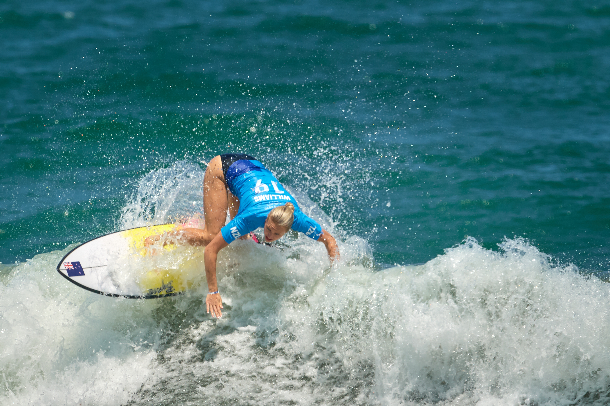 Photograph of Ella Williams of New Zealand during the women's surfing competition at Tsurigasaki Surfing Beach at the Tokyo 2020 Olympics.